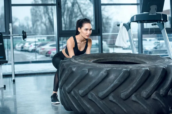 Attractive Sporty Woman Flipping Workout Wheel Gym — Free Stock Photo