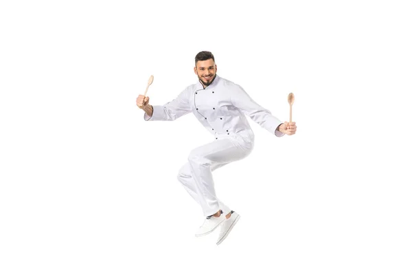 Joven Chef Masculino Con Utensilios Saltando Sonriendo Cámara Aislada Blanco — Foto de Stock