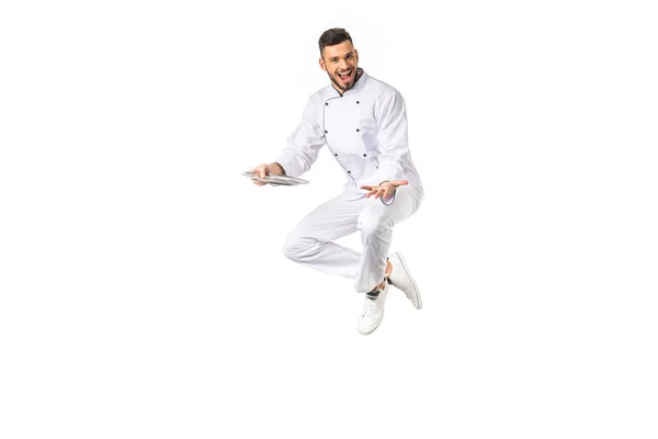 Happy Young Male Chef Plate Jumping Smiling Camera Isolated White — Stock Photo, Image