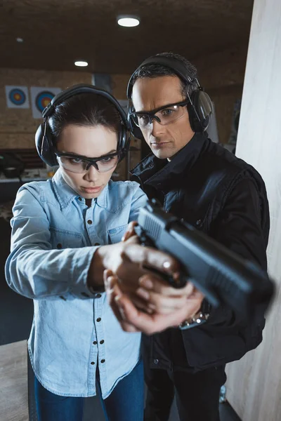 Instructor Helping Customer Holding Gun — Stock Photo, Image