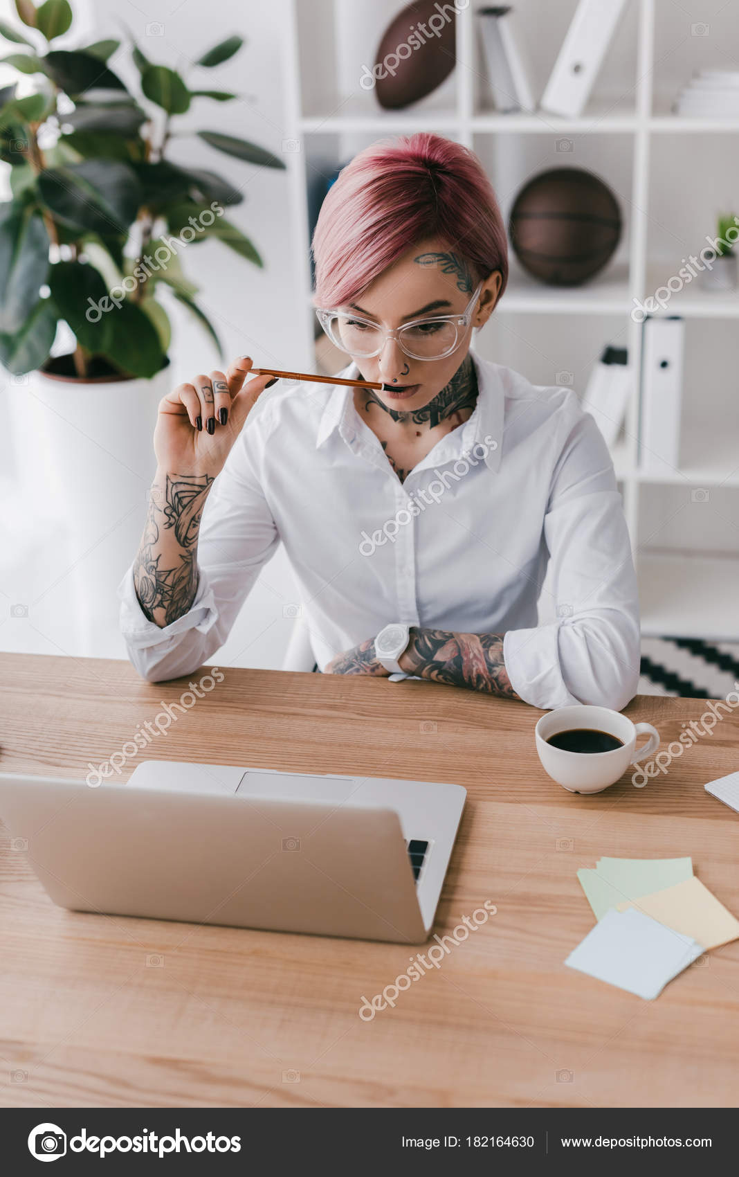 Young Businesswoman Tattoos Holding Pencil Using Laptop Workplace — Free  Stock Photo © VitalikRadko #182164630