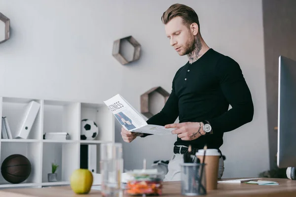 Handsome Young Tattooed Businessman Reading Newspaper Office — Stock Photo, Image