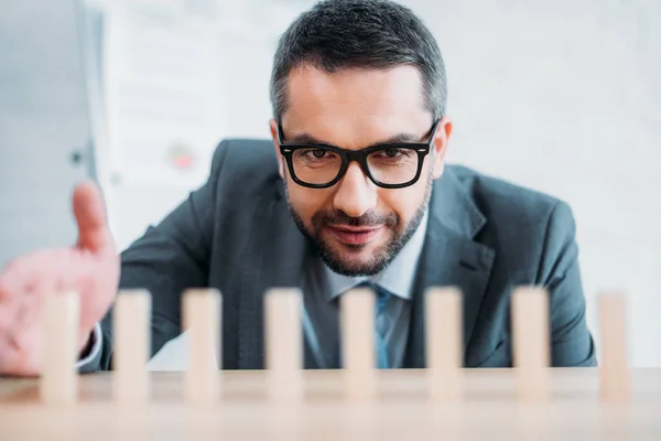 Close Shot Businessman Assembling Wooden Blocks Row Worktable Dominoes Effect — Stock Photo, Image