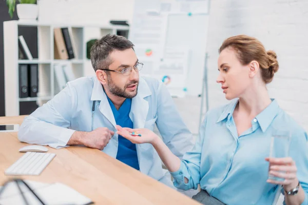 Businesswoman Taking Pills While Doctor Giving Consultation Workplace — Stock Photo, Image