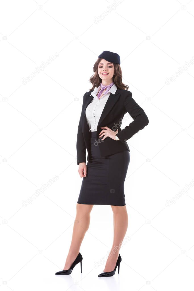 beautiful stewardess with arm akimbo isolated on white