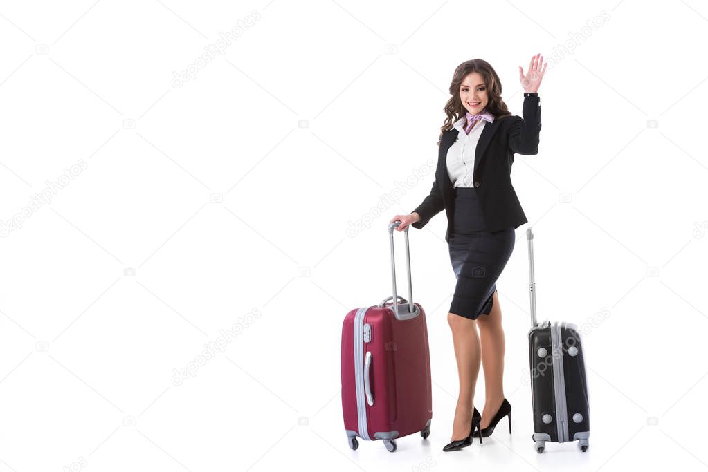 attractive stewardess waving hand isolated on white