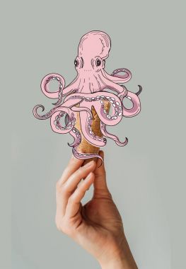 Cropped image of woman holding waffle ice cream cone with octopus isolated on gray clipart