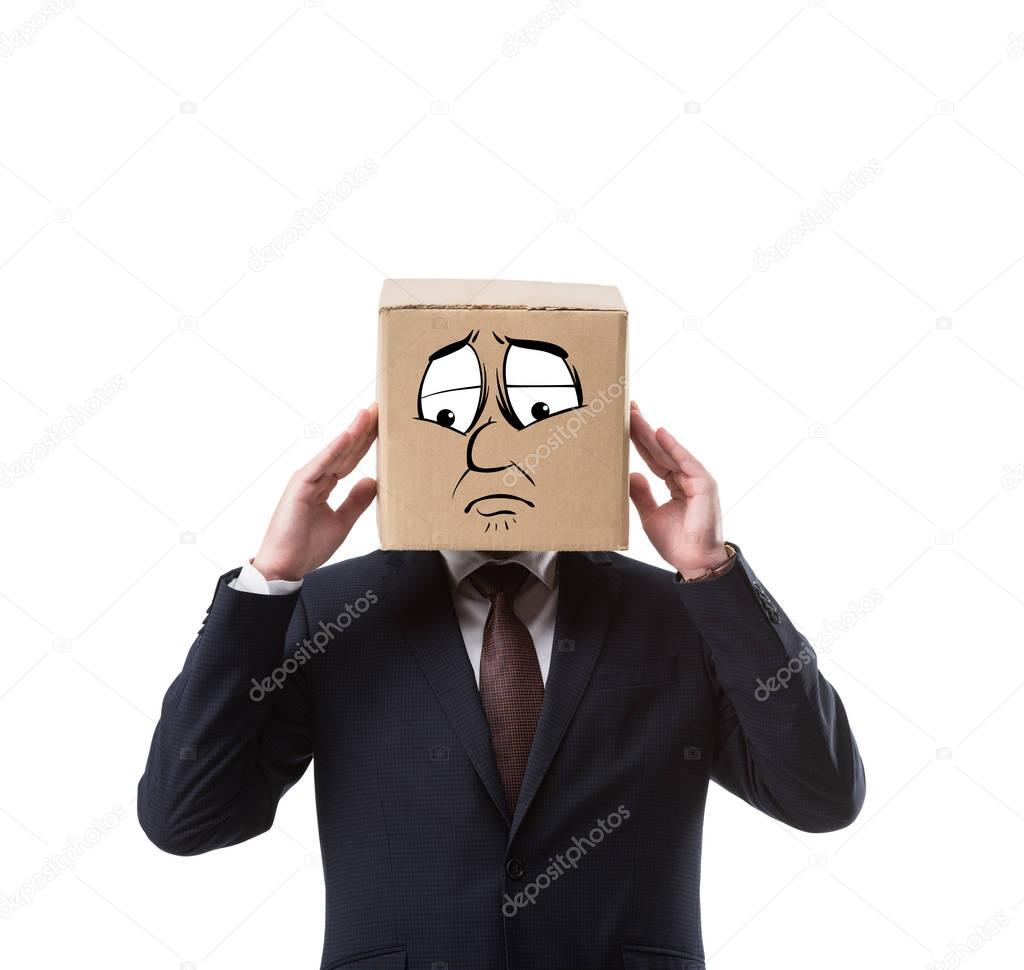 businessman with cardboard box on head having headache isolated on white 