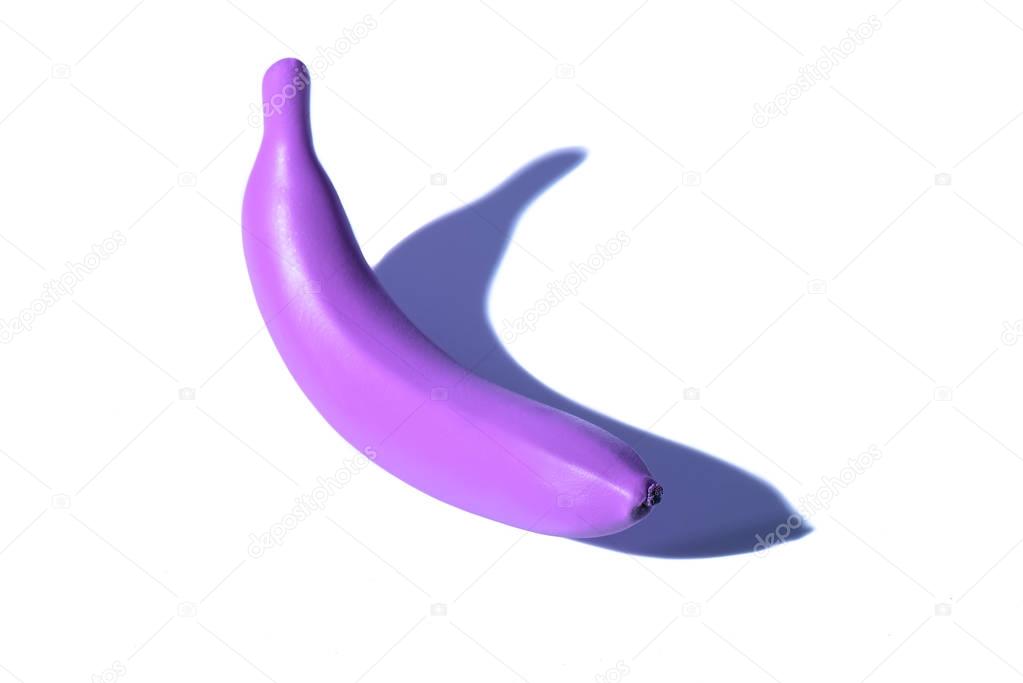plastic purple banana on white background