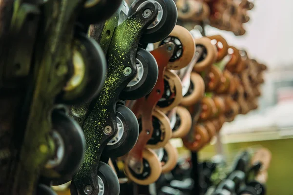 close up view of arranged roller skates in indoors skate park