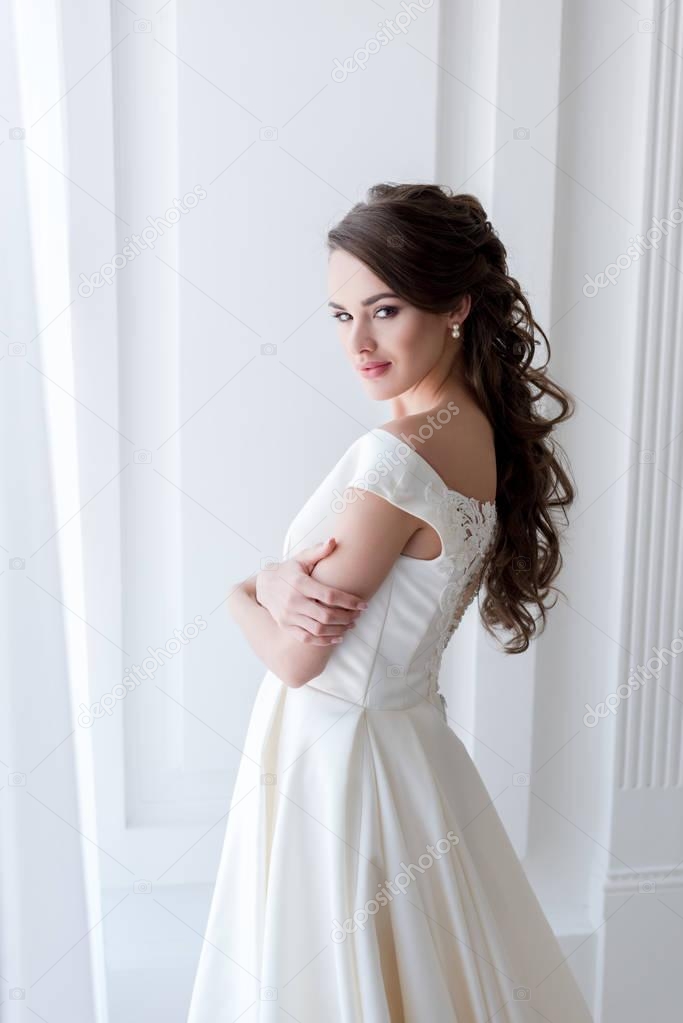 attractive bride in elegant wedding dress