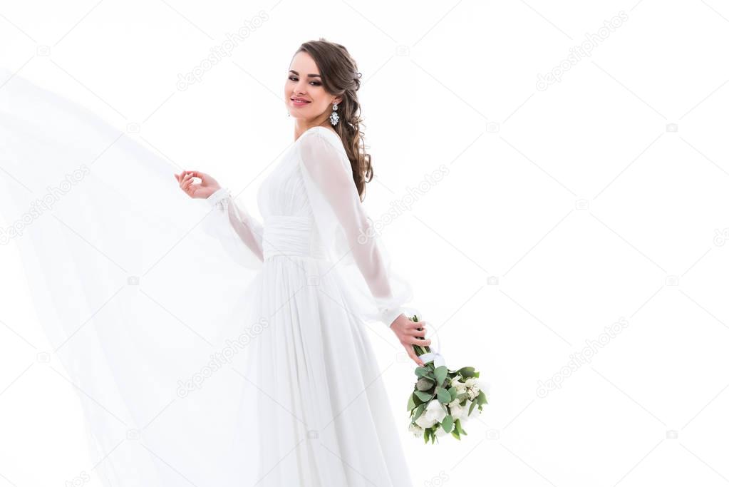 happy beautiful bride posing in white dress with wedding bouquet, isolated on white
