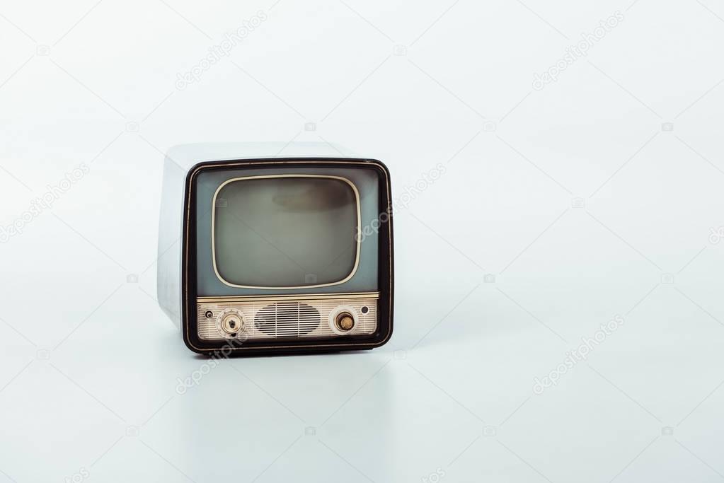 old small vintage television on white