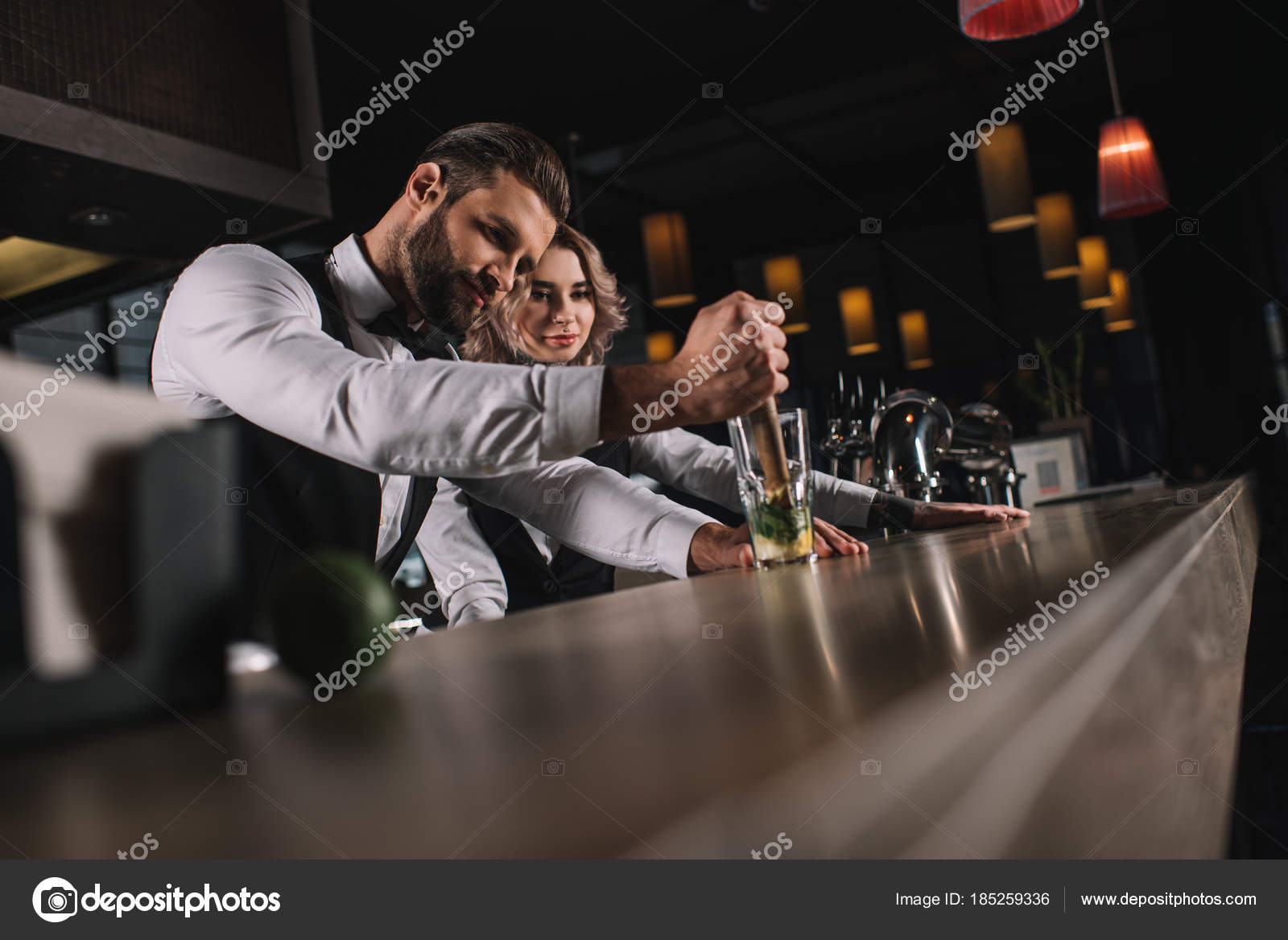 Male Bartender Showing Colleague How Prepare Drink Bar Stock Photo by
