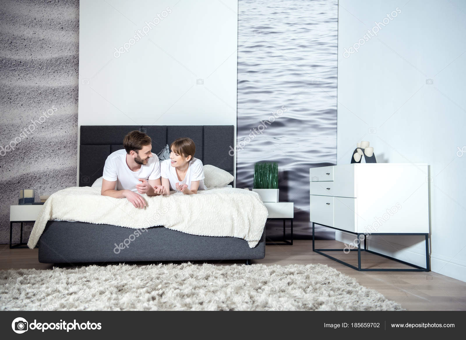 Smiling Couple Talking Lying Bed Cozy Bedroom Modern