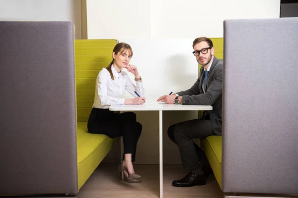 Business Colleagues Sittng Table Pens Papers — Free Stock Photo