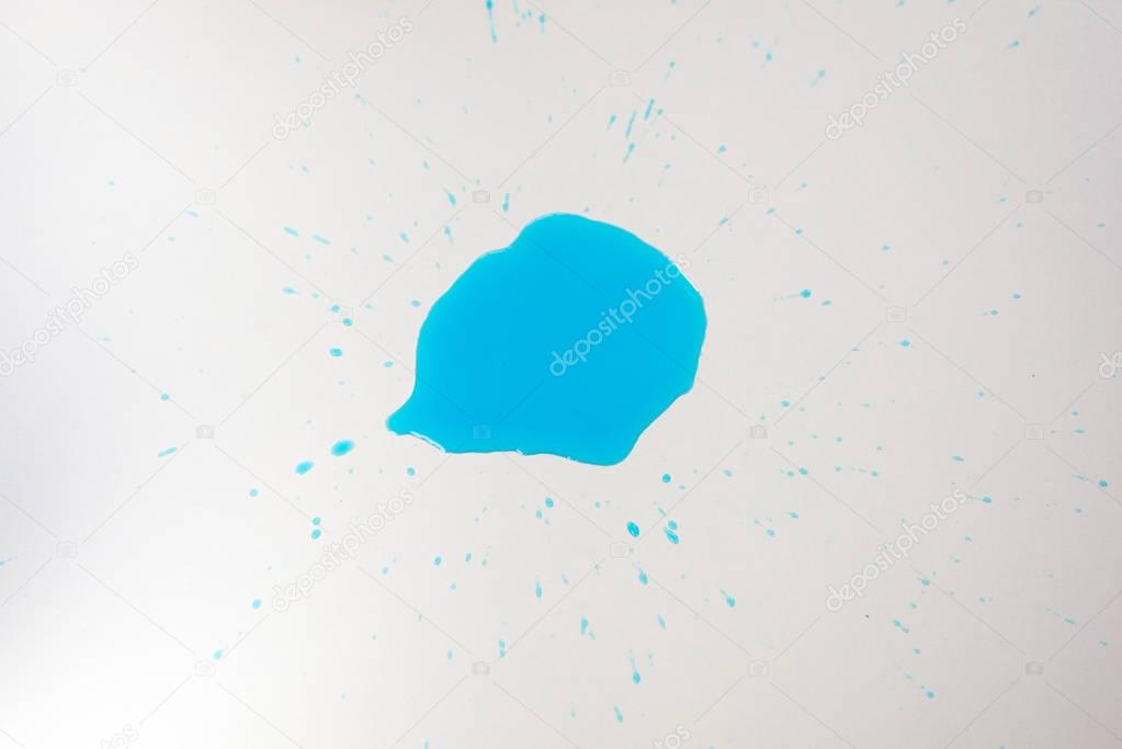 close up view of blue blot of reagent isolated on white tabletop