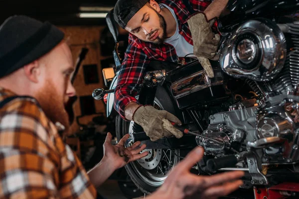 Concentrated Mechanics Repairing Motorcycle Together Garage — Stock Photo, Image