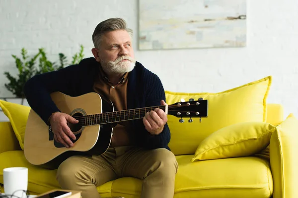 Pensive Bearded Senior Man Playing Guitar Looking Away Home — Stock Photo, Image