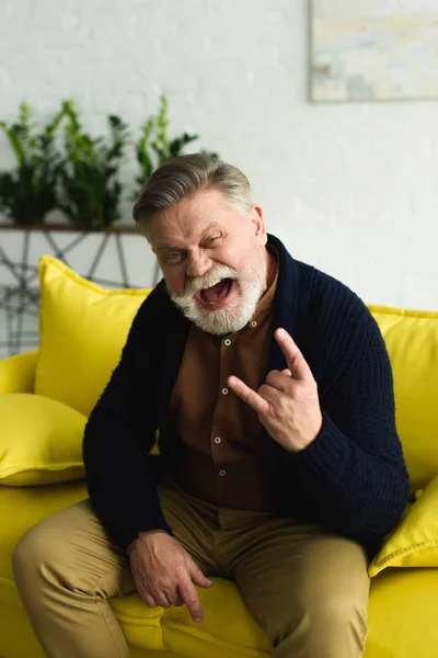 Excited Bearded Senior Man Showing Rock Gesture Screaming Camera — Stock Photo, Image