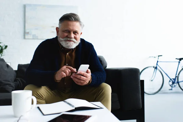 Handsome Bearded Man Using Smartphone Smiling Camera — Free Stock Photo