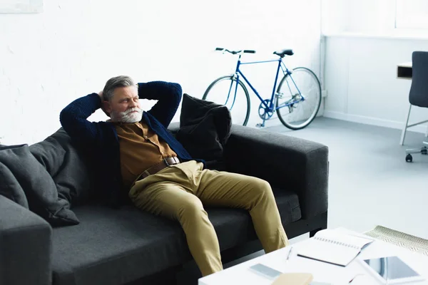 Handsome Bearded Senior Man Sitting Hands Head Sofa Home — Stock Photo, Image
