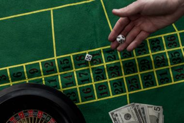 top view of man gambling on roulette at casino, gambling addiction concept clipart