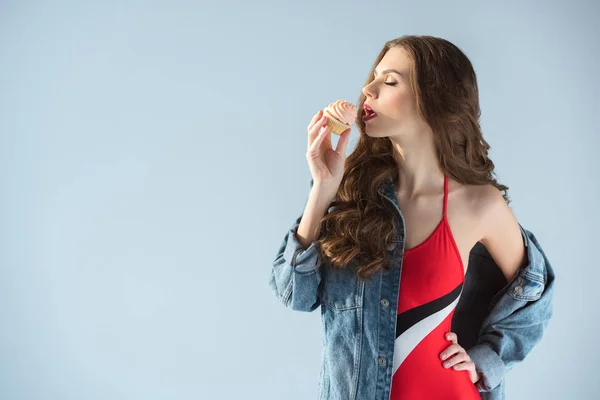 Side View Seductive Woman Red Swimsuit Eating Cupcake Isolated Grey — Stock Photo, Image