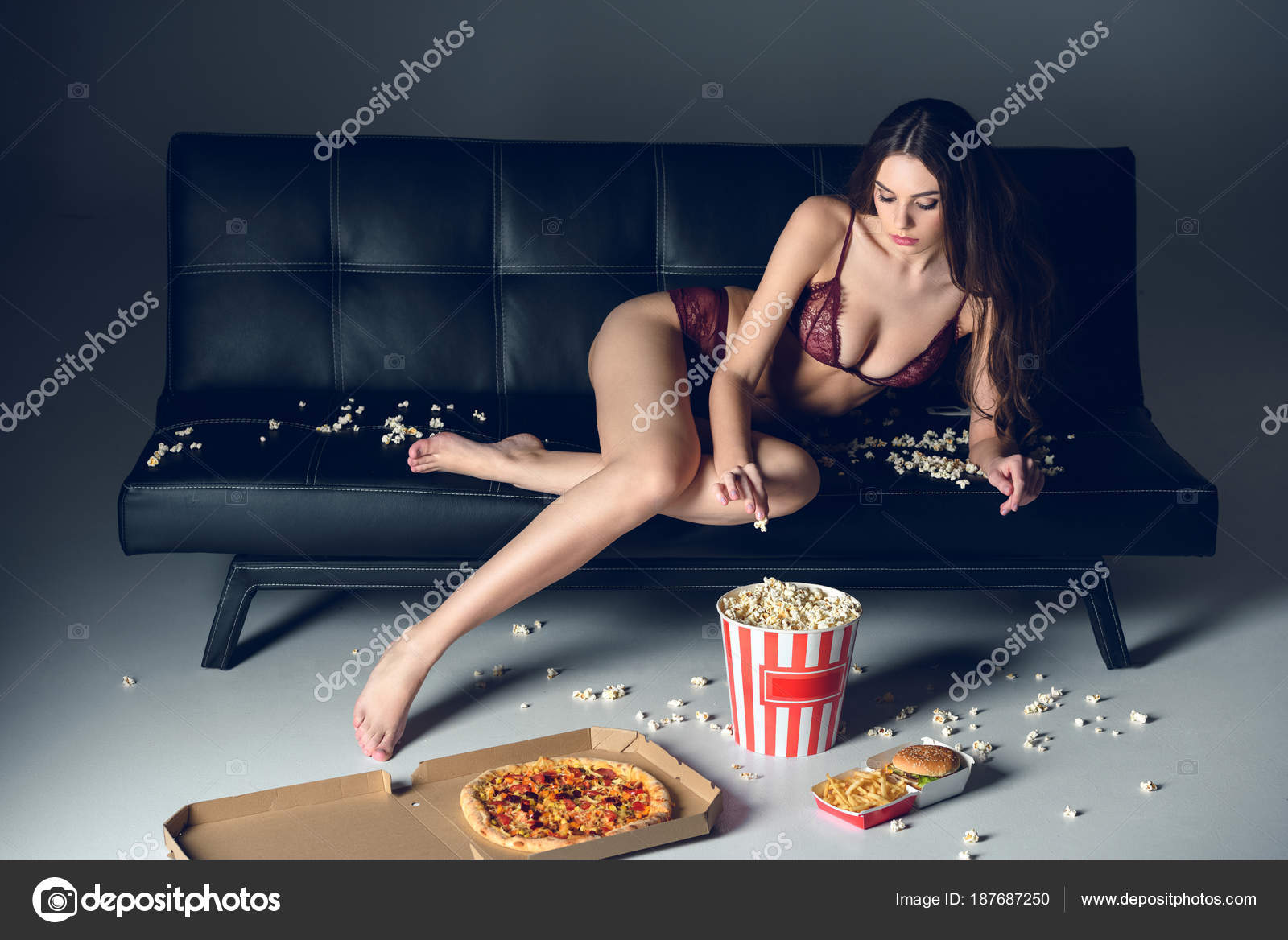 Sexy Girl Lying Sofa Lace Lingerie Eating Popcorn Stock Photo