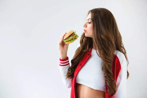 Side View Seductive Girl Baseball Jacket Looking Burger Isolated White — Stock Photo, Image