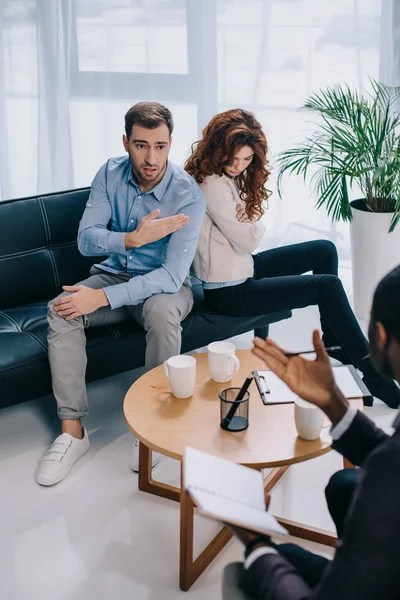 Young Man Pointing Girlfriend Talking African American Counselor — Stock Photo, Image