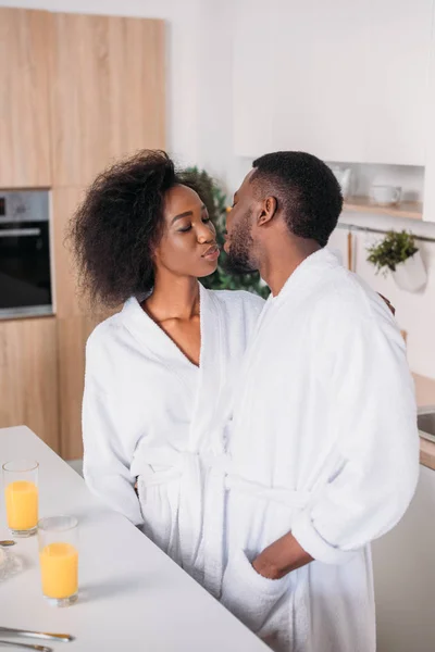 Young African American Couple Kissing Kitchen — Free Stock Photo