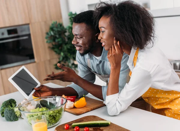 Young Couple Looking Recipe Digital Tablet While Standing Table Vegetables — Stock Photo, Image