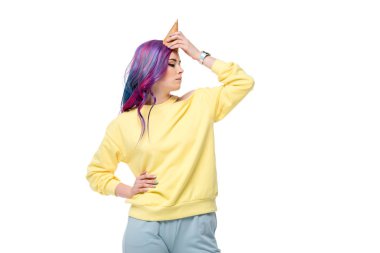 young woman pretending unicorn with waffle cone on forehead isolated on white clipart