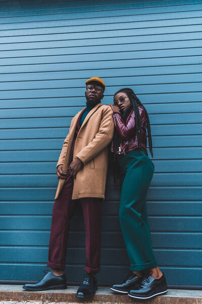 low angle view of stylish african american couple looking at camera while posing together on street