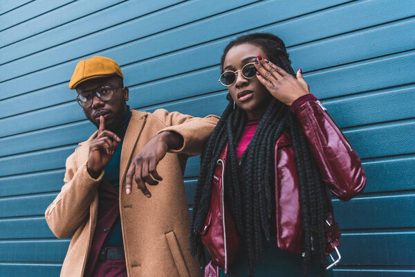 stylish young african american couple standing together on street