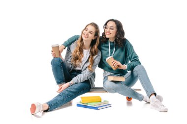 smiling multicultural students hugging and holding coffee in paper cups isolated on white clipart