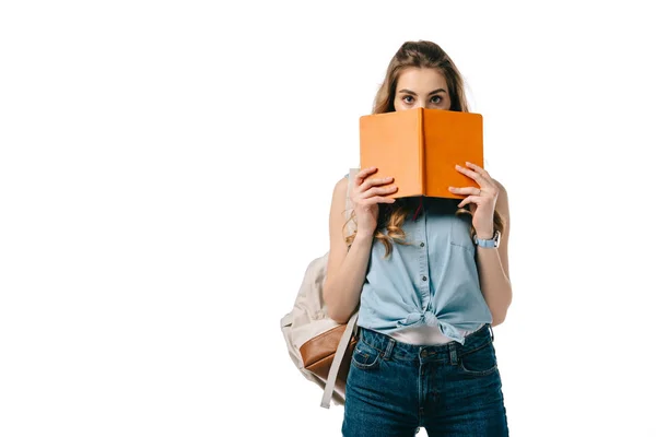 Bella Studentessa Guardando Fuori Dal Libro Isolato Bianco — Foto Stock