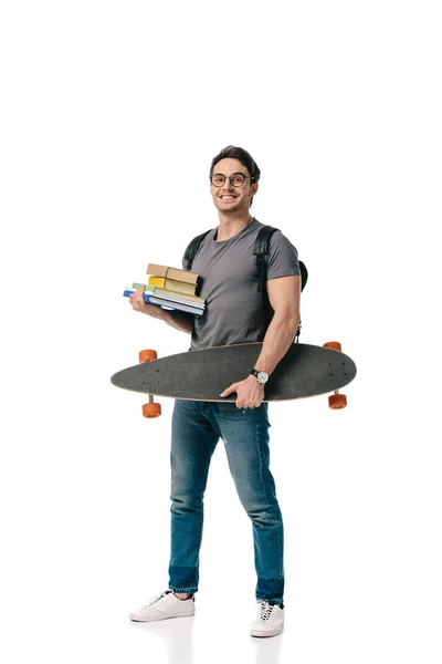 Sonriente Guapo Estudiante Sosteniendo Libros Patinar Aislado Blanco — Foto de Stock