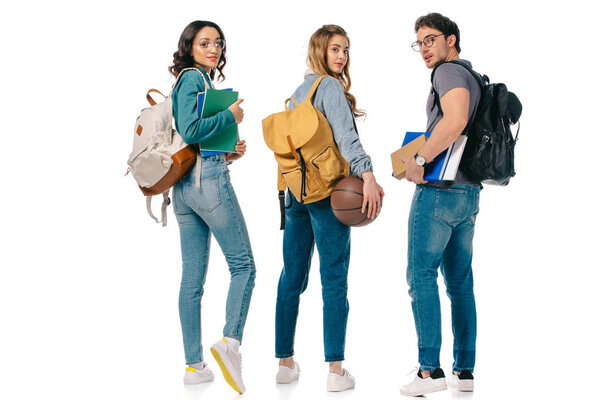 multicultural students with backpacks and basketball ball isolated on white