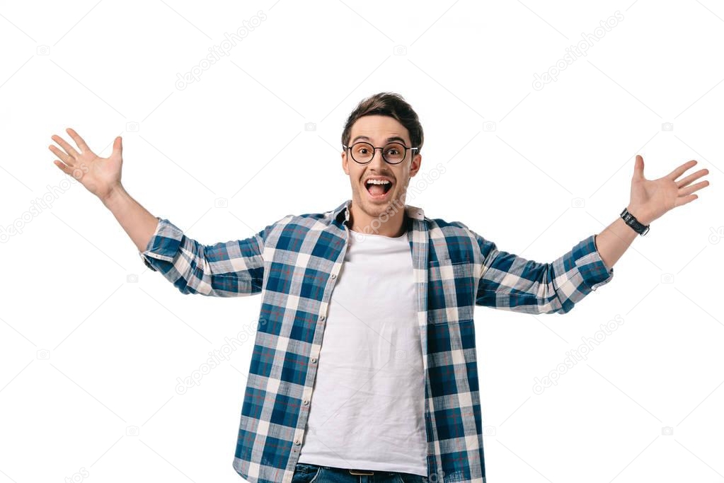 excited handsome man looking at camera with open arms isolated on white