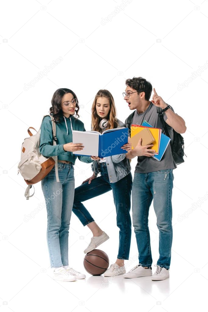 multicultural students looking at book and man showing idea sign on white