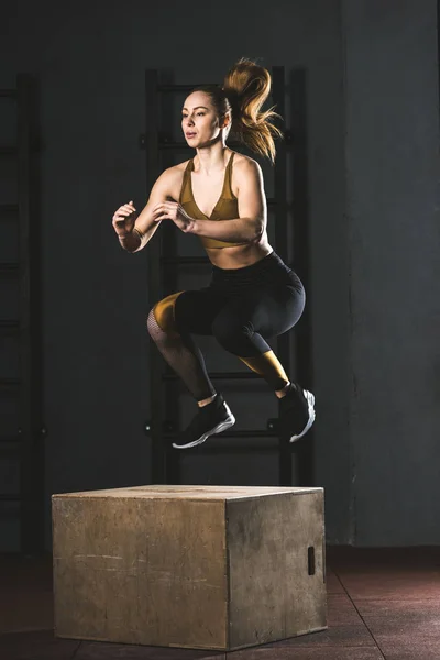 Young Sportswoman Jumping Wooden Block Gym — Stock Photo, Image