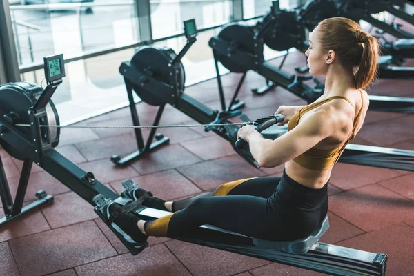 Young Sportswoman Doing Exercise Rowing Machine Sports Center — Stock Photo, Image