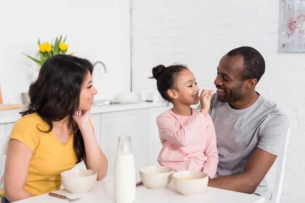Little Daughter Feeding Her Parents Kitchen Morning — Stock Photo, Image