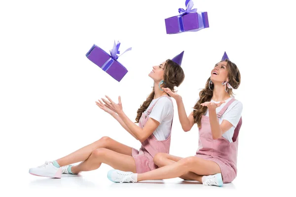 Happy Beautiful Young Twins Catching Falling Present Boxes White — Stock Photo, Image