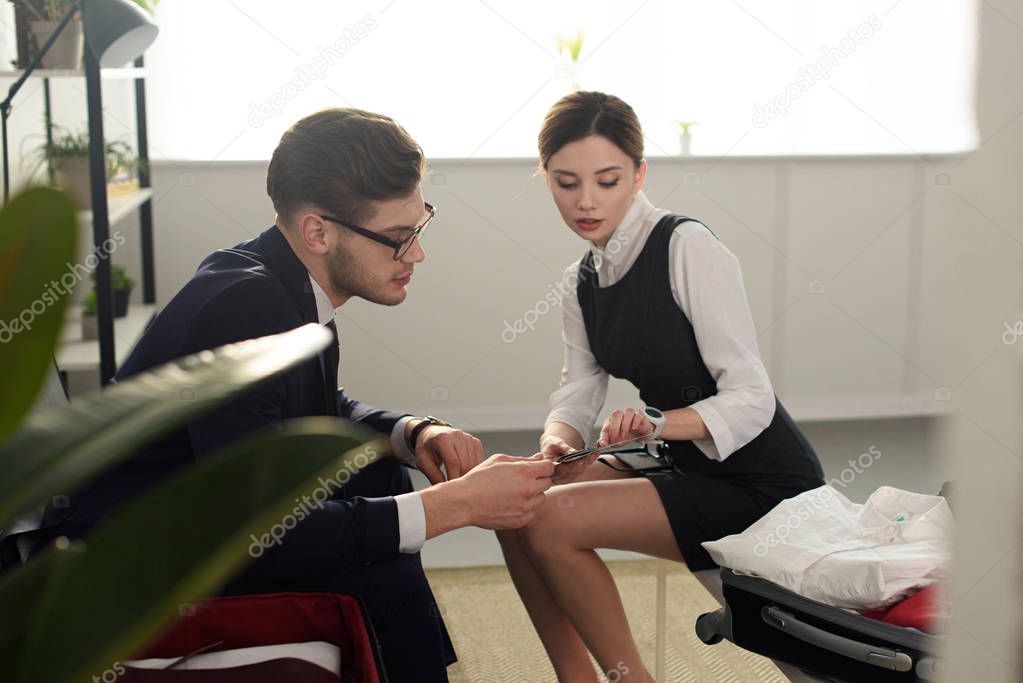 business couple looking at passports and air tickets for trip