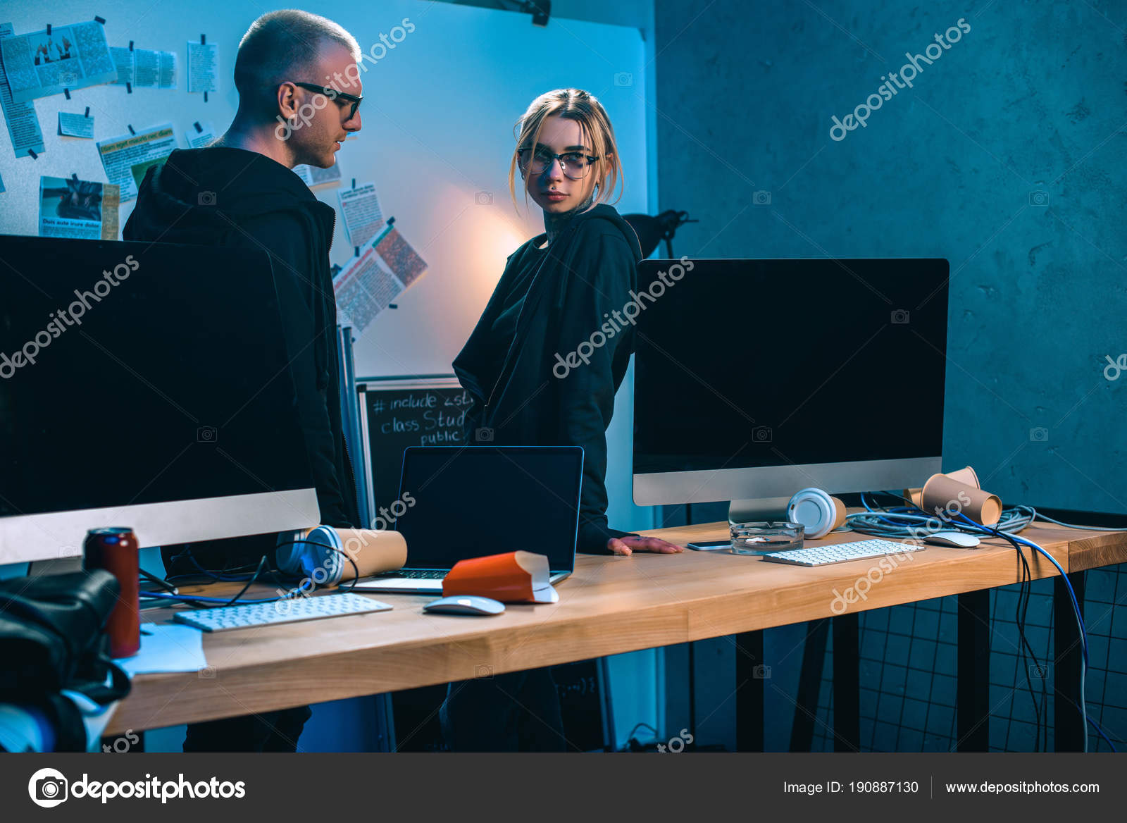 Couple Hackers Standing Desk Computers Dark Room Stock Photo