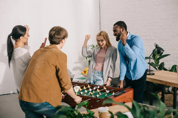 Happy Multicultural Business Colleagues Gesturing Playing Table Football Modern Office — Stock Photo, Image
