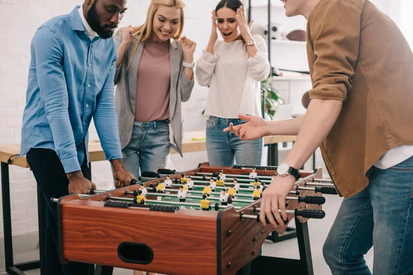 Cropped Image Businessmen Playing Table Football Front Female Colleagues — Stock Photo, Image